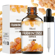 Frankincense essential oil bottle with plant leaves