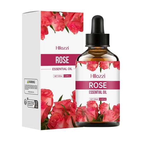 Rose essential oil bottle with rose petals