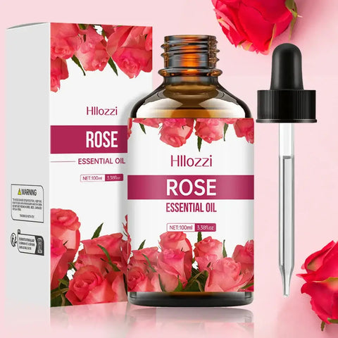 Rose essential oil bottle with rose petals