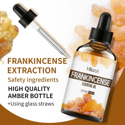 Frankincense essential oil bottle with plant leaves